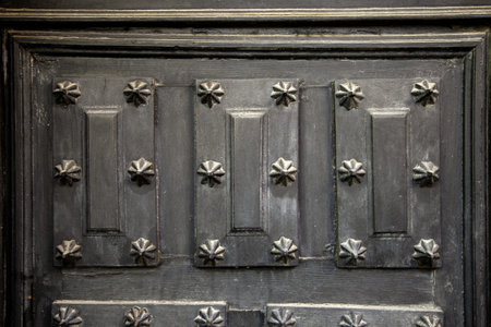 Old oak door with lock and knob, constructionの写真素材