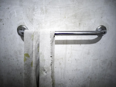 Dirty towel hanging in abandoned house, hygiene and cleaning, disinfectionの写真素材