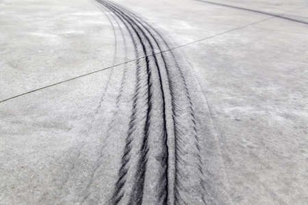 Wheel tracks on urban street, vehicle skidding, textureの写真素材