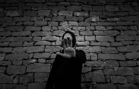 Young street gang with mask in park, social problemの写真素材