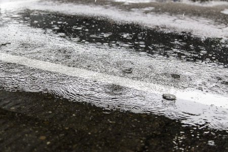 Raindrops on the street, bad weather and storm, humidity