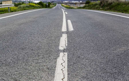 Detail of lines on the asphalt for cars, circulation on the roadの写真素材