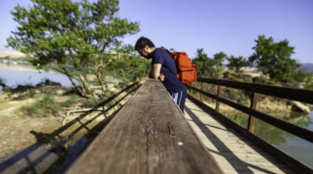 Detail of young man looking at nature, contemplation and relaxationの写真素材