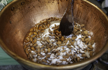 Detail of manufacturing of candied almonds, sugarの写真素材