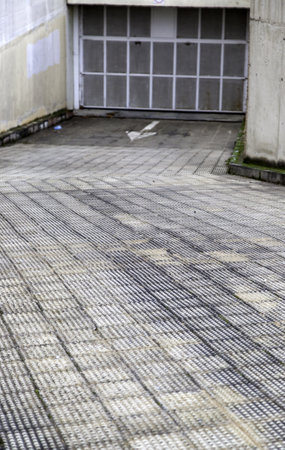 Detail of the entrance slope to a garage in the cityの写真素材