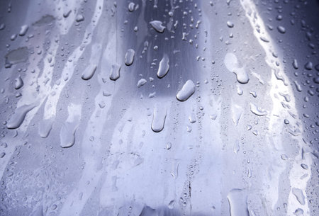 Detail of stainless steel surface wet from the rain