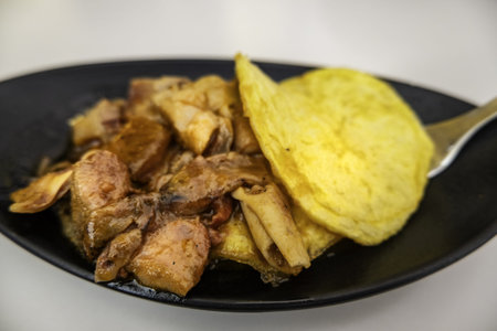 Detail of a tapa of squid with potatoes