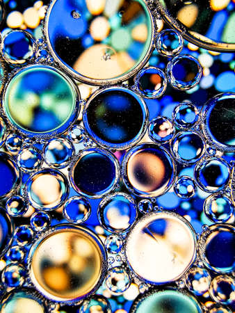 blue oil bubbles on liquid abstract texture for backgroundの写真素材