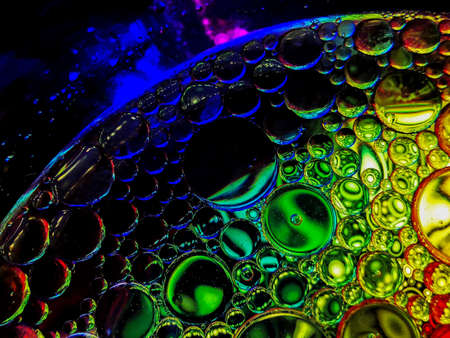 colorful rainbow spectrum oil bubbles macro abstract texturesの写真素材