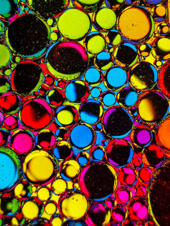 neon rainbow colorful oil bubbles abstract textures for backgroundsの写真素材