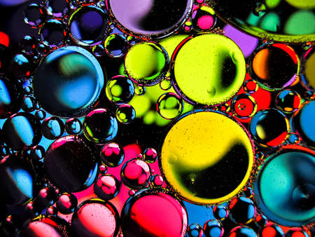 neon rainbow colorful oil bubbles abstract textures for backgroundsの写真素材