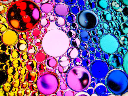 neon rainbow colorful oil bubbles abstract textures for backgroundsの写真素材