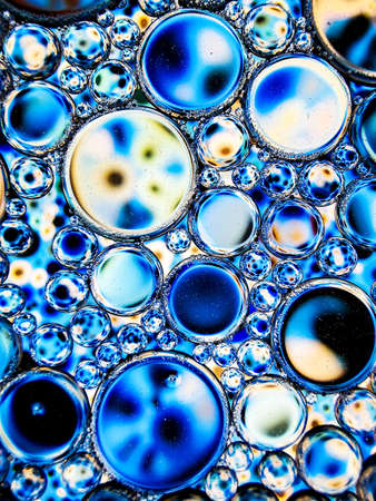 blue oil bubbles on liquid abstract texture for backgroundの写真素材
