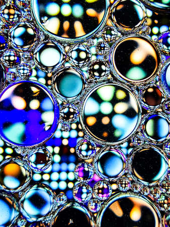 blue oil bubbles on liquid abstract texture for backgroundの写真素材