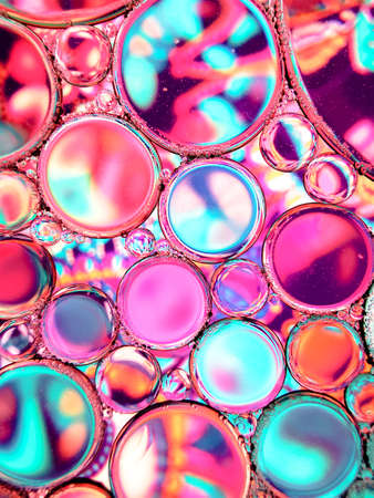 magenta cyan oil bubbles abstract texturesの写真素材