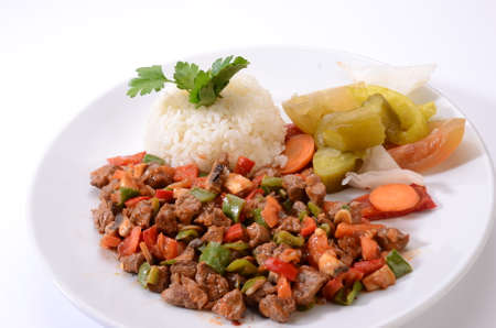 meat saute with rice white backgroundの写真素材