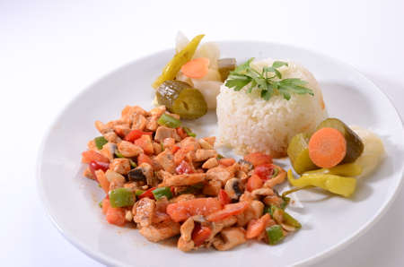 chicken saute with rice white backgroundの写真素材