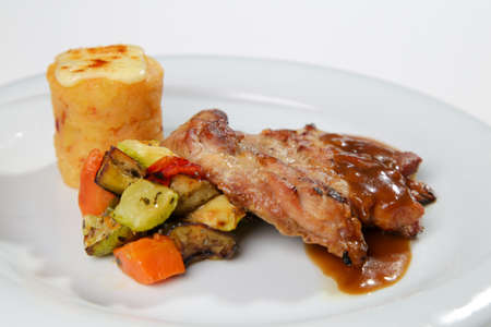 barbeque sauced marinated grilled chicken with side dish isolated whiteの写真素材