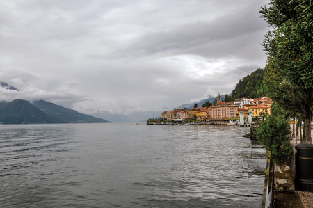 View of Lake Como in cloudy day with the buildings of Bellagio, a charming tourist village between the lake and the mountains of the Alps. Located in the Lombardy region, northern Italyの写真素材