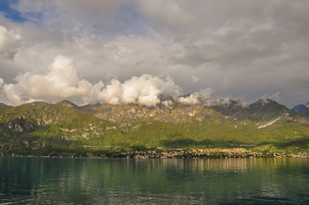 Overview of Lake Como with mountains and villages in a cloudy day near Bellagio, a charming tourist village between the lake and the mountains. Located in the Lombardy region, northern Italyの写真素材