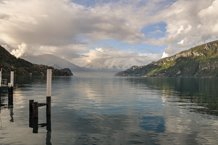 Overview of Lake Como with mountains and villages in a cloudy day near Bellagio, a charming tourist village between the lake and the mountains. Located in the Lombardy region, northern Italyの写真素材