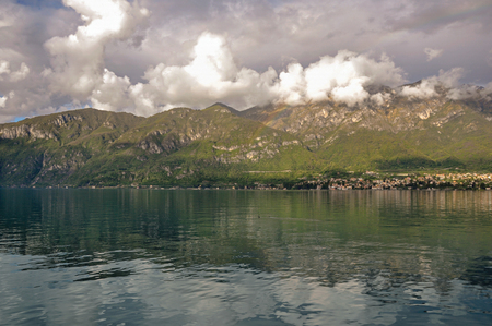 Overview of Lake Como with mountains and villages in a cloudy day near Bellagio, a charming tourist village between the lake and the mountains. Located in the Lombardy region, northern Italyの写真素材
