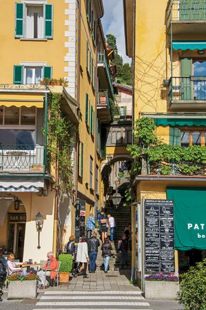 Como, Italy - May 06, 2013. View of narrow alley in hillside and people in Bellagio, a charming tourist village between the lake and the mountains. Located in the Lombardy region, northern Italyのeditorial素材