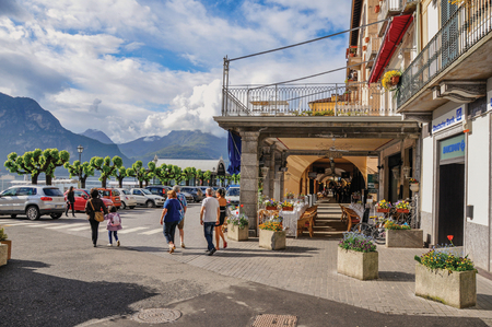 Como, Italy - May 06, 2013. View of people walking on the shore of Lake Como in Bellagio, a charming village between the lake and the mountains of Alps. Lombardy region, northern Italyのeditorial素材