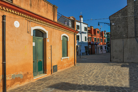 Overview of colorful terraced houses in an alley, in the sunset at the city center of Venice, the historic and amazing marine city. Located in the Veneto region, northern Italyの写真素材