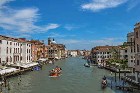 View of the Grand Canal with boats and buildings on the bank, at the city center of Venice, the historic and amazing marine city. Located in Veneto region, northern Italyのeditorial素材
