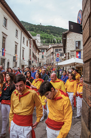Gubbio, Italy - May 15, 2013. Colorful crowd participating in the "Feast of Ceri", a traditional event of the city of Gubbio, a well preserved medieval town. Located in Umbria region, central Italyのeditorial素材