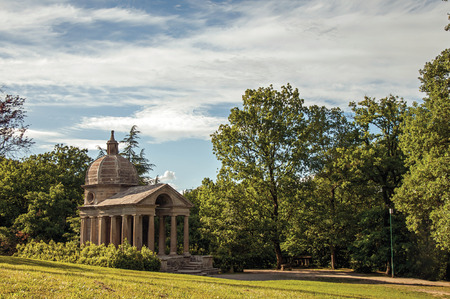 View of stone small temple at sunset amidst the vegetation in the Park of Bomarzo, also known as Park of Monsters, near Viterbo. Located in the Lazio region, central Italyの写真素材