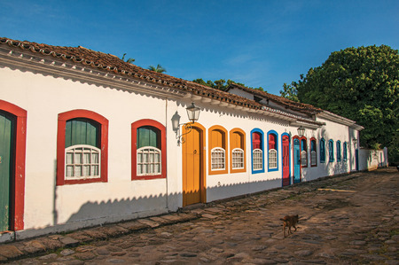 Paraty, Brazil - January 25, 2015. Cobblestone street with old houses under blue sunny sky in Paraty, the historic town totally preserved in the coast of Rio de Janeiro State, southwestern Brazilのeditorial素材