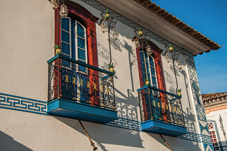 Close-up of the colorful wall decoration of old house at the sunset in Paraty, an amazing and historic town totally preserved in the coast of Rio de Janeiro State, southwestern Brazilの写真素材