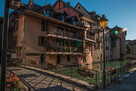 Annecy, France - June 28, 2016. Bridge and old building facing the canal at sunset, in the city center of historic Annecy, department of Haute-Savoie, south-eastern France.のeditorial素材