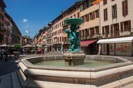 Chambery, France - July 01, 2016. Square with buildings, restaurant and fountain, in the city center of the lovely Chambery. In the Savoie department, Auvergne-Rhône-Alpes region, south-eastern Franceのeditorial素材