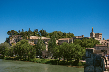 Pont d'Avignon (bridge) view from the historical center of the city of Avignon, under a sunny blue sky. In Vaucluse department, Provence-Alpes-Côte d'Azur region, southeastern Franceの写真素材