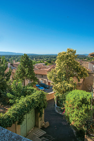 Chateauneuf-de-Gadagne, France - July 07, 2016. Traditional Provence houses on alley at sunrise, in Chateauneuf-de-Gadagne. Vaucluse department. Provence region, southeastern France. Retouched photoのeditorial素材