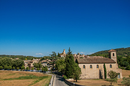 Panoramic view of the village of Lourmarin, its main street and hills in the background. In the Vaucluse department, Provence-Alpes-C?te d'Azur region, southeastern Franceのeditorial素材