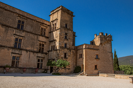 Panoramic of the courtyard and castle facade of Lourmarin with hills in the background, near the village of Lourmarin. In Vaucluse department, Provence-Alpes-C?te d'Azur region, southeastern Franceのeditorial素材