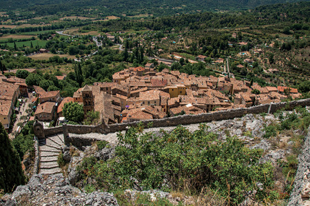 Moustiers-Sainte-Marie, France - July 08, 2016. View of stone staircase, roofs and belfry in the charming village of Moustiers-Sainte-Marie. Provence region, southeastern Franceの写真素材
