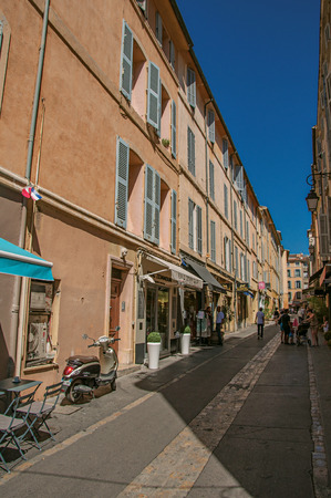 Aix-en-Provence, France - July 09, 2016. Alley with people and blue sky in Aix-en-Provence, a lively town in the French countryside. Bouches-du-Rhone department, Provence region, southeastern Franceのeditorial素材