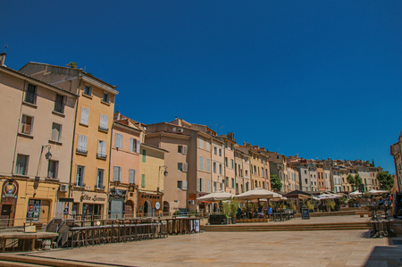 Aix-en-Provence, France - July 09, 2016. Square with colorful buildings and restaurant umbrella in Aix-en-Provence, a lively town in the French countryside. Provence region, southeastern Franceのeditorial素材