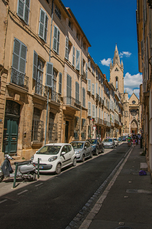 Aix-en-Provence, France - July 09, 2016. Street with buildings and Saint Jean of Malte Church in Aix-en-Provence, a pleasant and lively town in the countryside. Provence region, southeastern Franceのeditorial素材