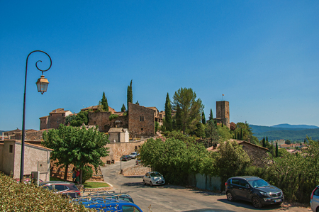 Les Arcs-sur-Argens, France - July 10, 2016. Panoramic view of the lovely hamlet of Les Arcs-sur-Argens on top of a hill and under sunny blue sky. Provence region, Var department, southeastern Franceのeditorial素材