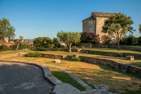 View of the tower clock on the top of the hill in the light of sunset, over the lively and gracious town of Draguignan. Located in the Var department, Provence region, southeastern Franceの写真素材