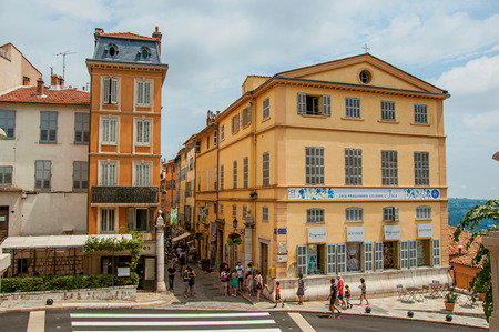 Grasse, France - July 12, 2016. Buildings and streets with people in Grasse, the friendly town known for producing perfumes. In Alpes-Maritimes department, Provence region, southeastern Franceのeditorial素材