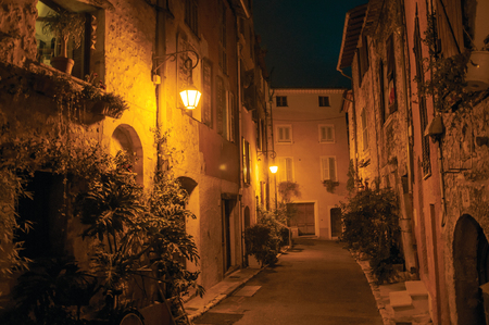 Night view of alley with walls and stone houses in the village of Vence, a stunning medieval town completely preserved. Located in the Alpes-Maritimes department, Provence region, southeastern Franceの写真素材