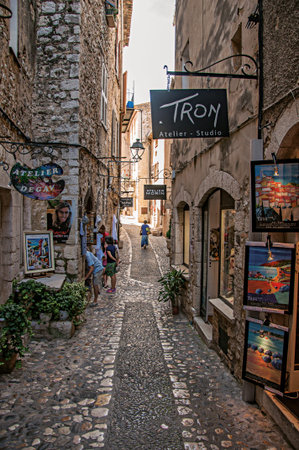 Saint-Paul-de-Vence, France - July 13, 2016. View of stone street with shop in the village of Saint-Paul-de-Vence, stunning medieval town completely preserved. In Provence region, southeastern Franceのeditorial素材
