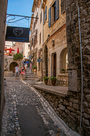 Saint-Paul-de-Vence, France - July 13, 2016. View of stone street with shop in the village of Saint-Paul-de-Vence, stunning medieval town completely preserved. In Provence region, southeastern Franceのeditorial素材